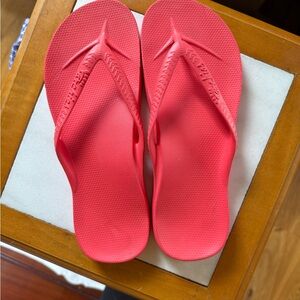 Archie’s Red Flip Flops